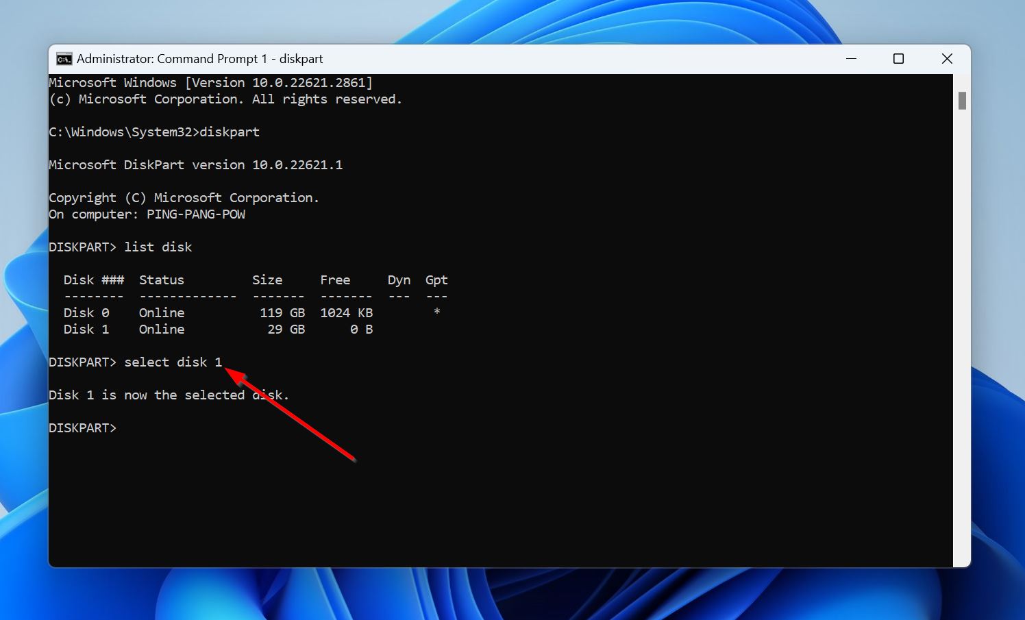 A command prompt window showing the DiskPart tool after the 'select disk 1' command has been executed, indicating that Disk 1 is now the selected disk, with a red arrow pointing to the confirmation message.