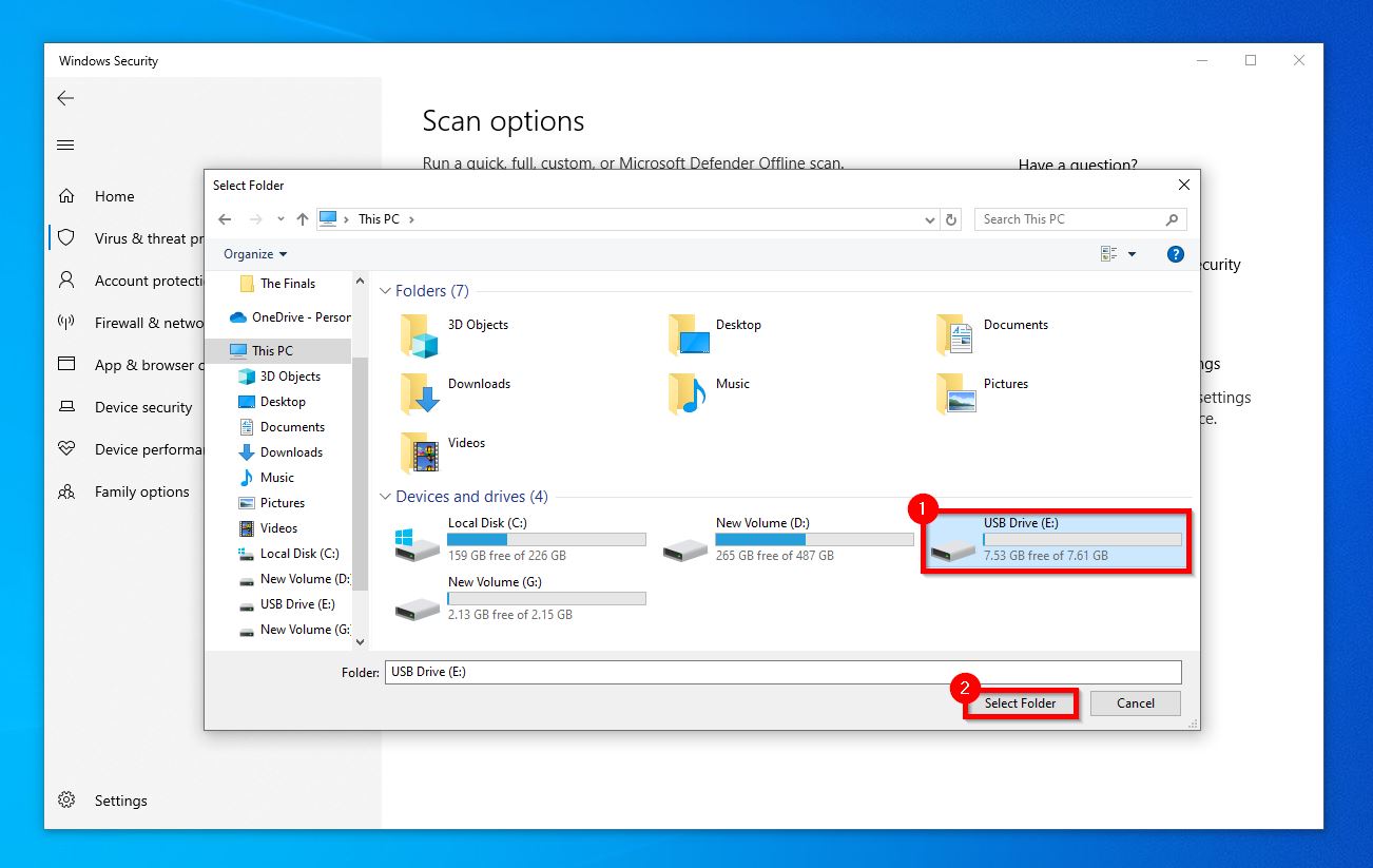 Windows Security dialog box open on the Select Folder tab with USB Drive (E:) highlighted for a custom scan.